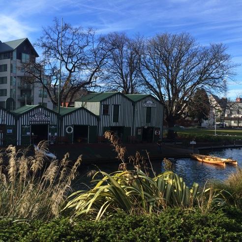 The iconic Antigua Boat Sheds from the other side of the Avon River.