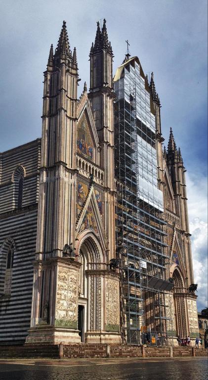 discover the orvieto cathedral, an architectural masterpiece nestled in the heart of italy | admire the astonishing orvieto cathedral facade, one of the greatest examples of italian gothic architectural style