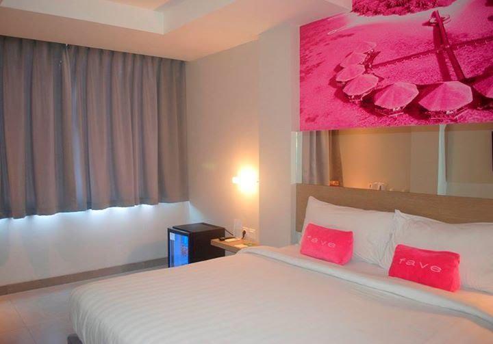 Bedroom with their signature bright pink decor