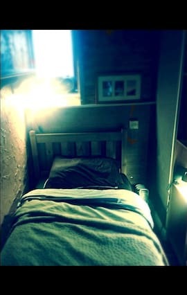 small single room with tv and dvd player