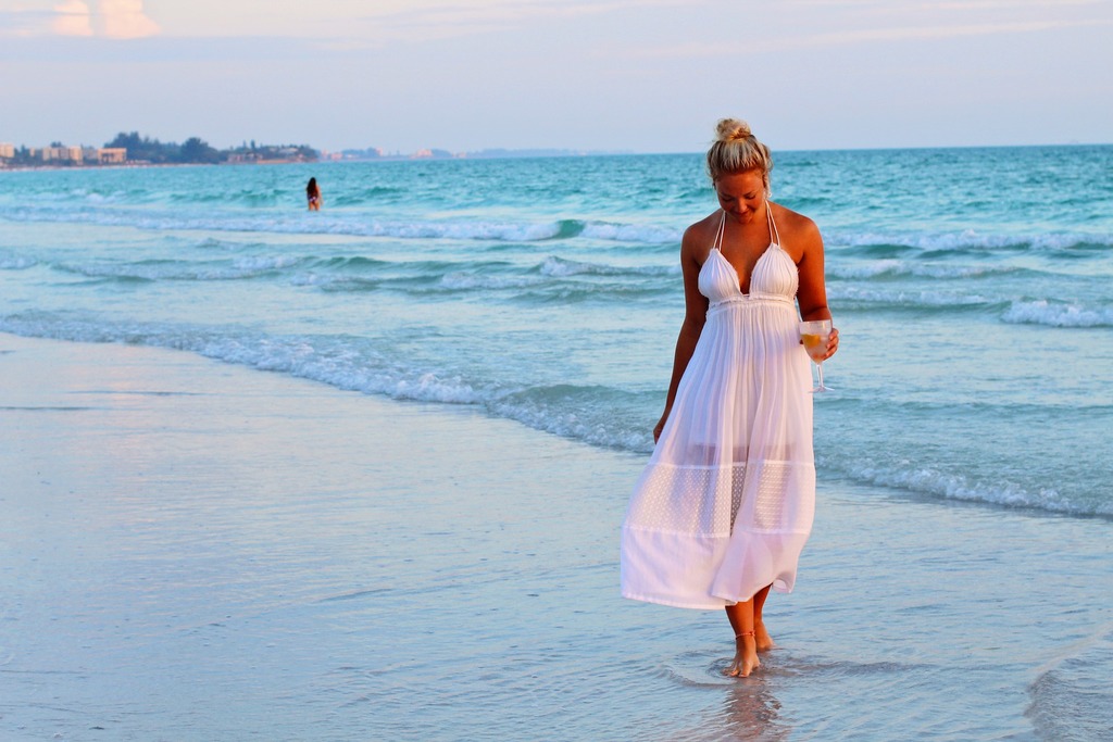 Girl in a maxi dress on the beach