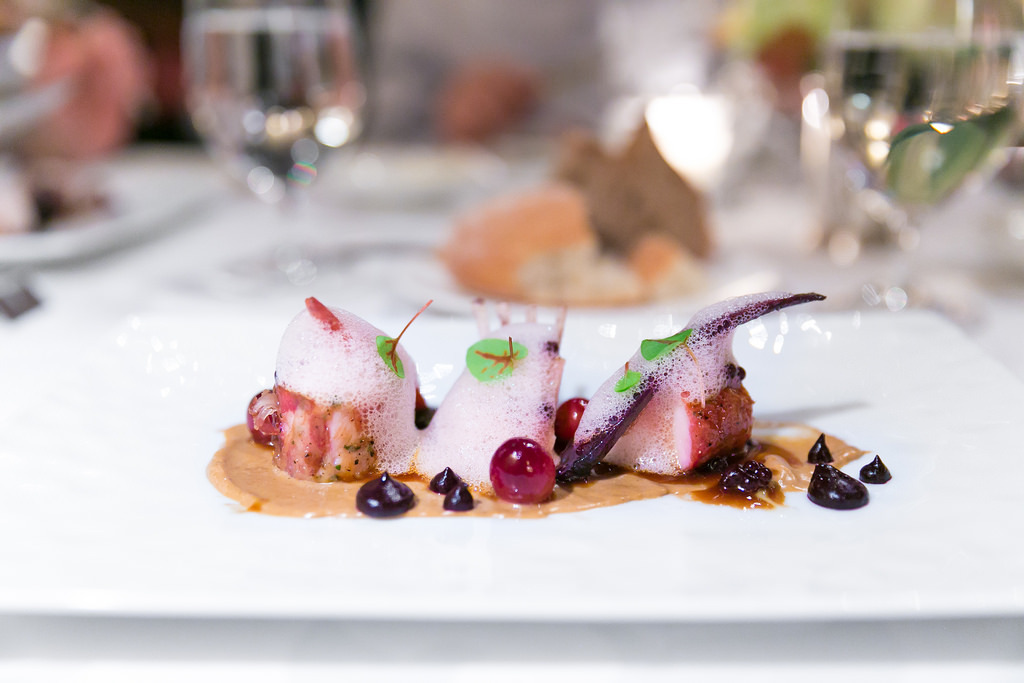 Prosciutto wrapped loin of rabbit with chanterelle purée, blueberry-balsamic pearl, and huckleberry