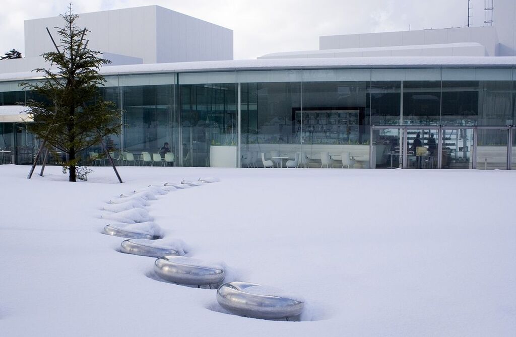 Outdoor chairs under snow, 21st Century Museum of Contemporary Art