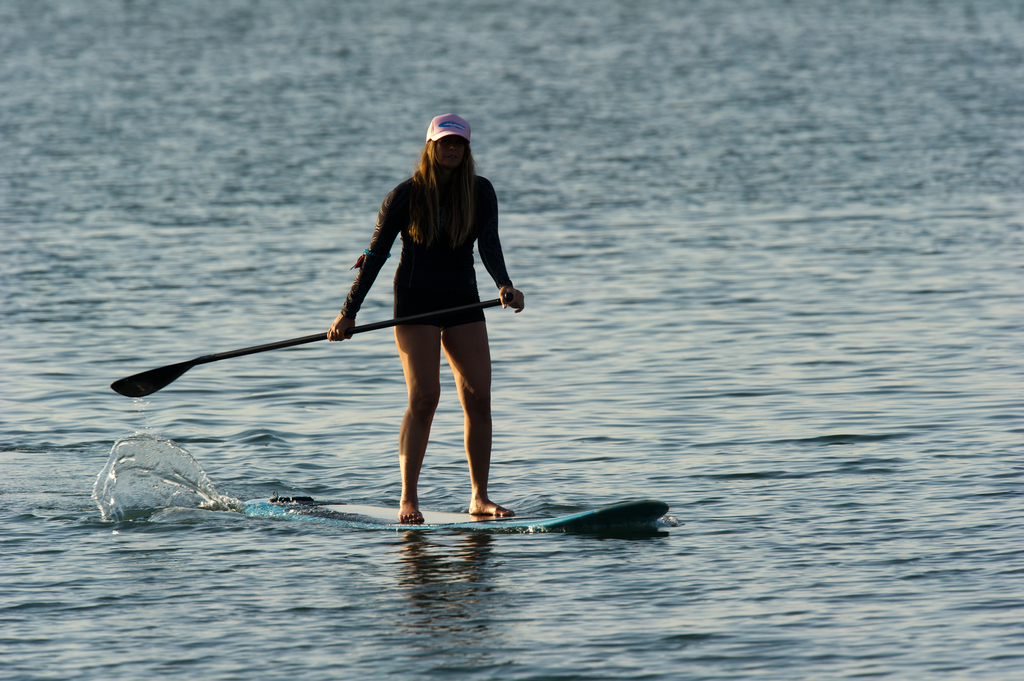 Woman stand up paddle surfing