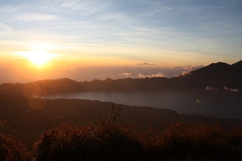 Sunrise over Lake Batur from the top of Mount Batur
