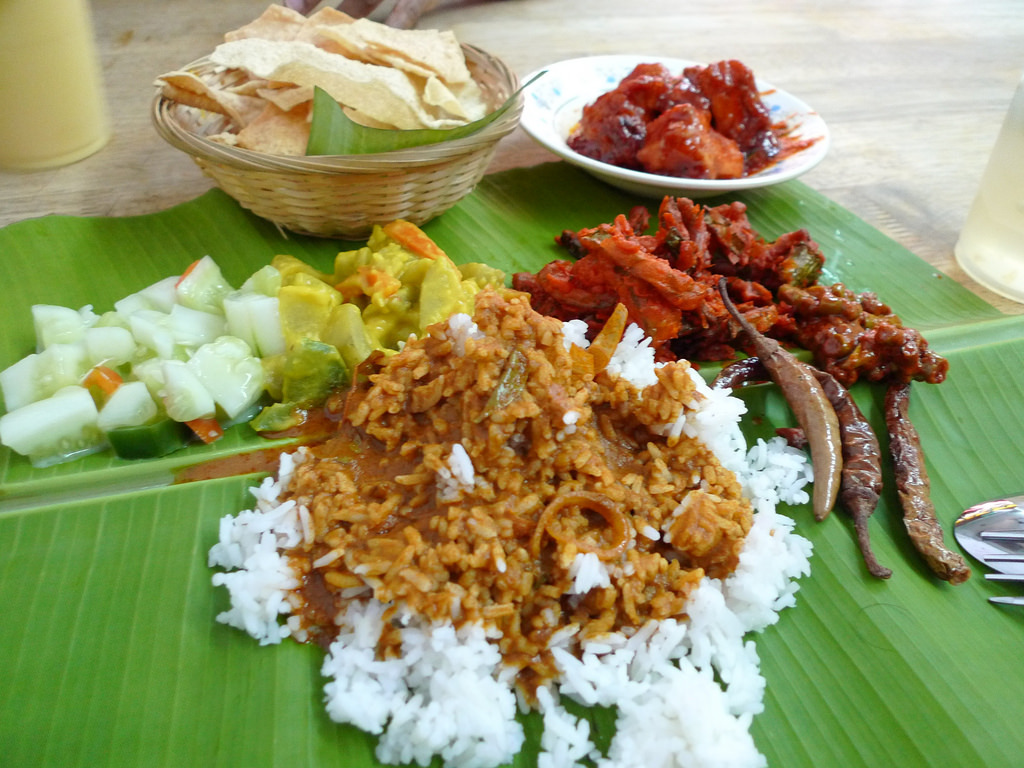 banana leaf rice with veg condiments, pappadom and honey chicken