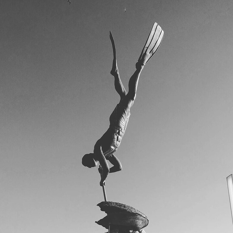 Life size statue of El Buzo (the diver) prying open an enormous oyster. This tradition is where Bucerias got its name, as many divers have worked here for years, diving for pearls and for food. I swam past some yesterday: the work goes on much as it has,