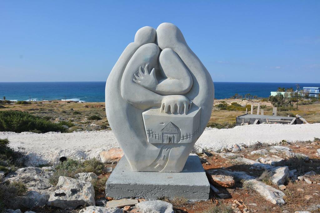 Back side- BEATA ROSTAS Exile Száműzöttek, Cyprus, Agia Napa, Sculpture Park Ayia Napa , limestone, 250x 180x 90 cm