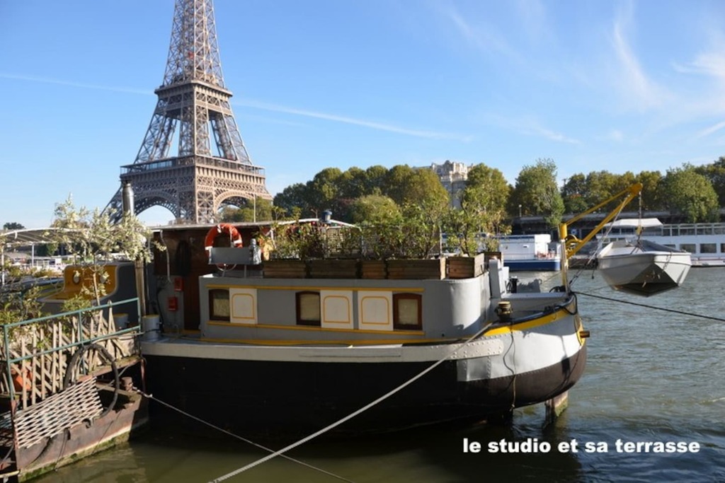 Step onto this unique houseboat with a gorgeous view of Paris