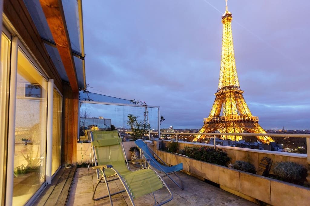 Lounge on the balcony for a breathtaking view of the Eiffel Tower