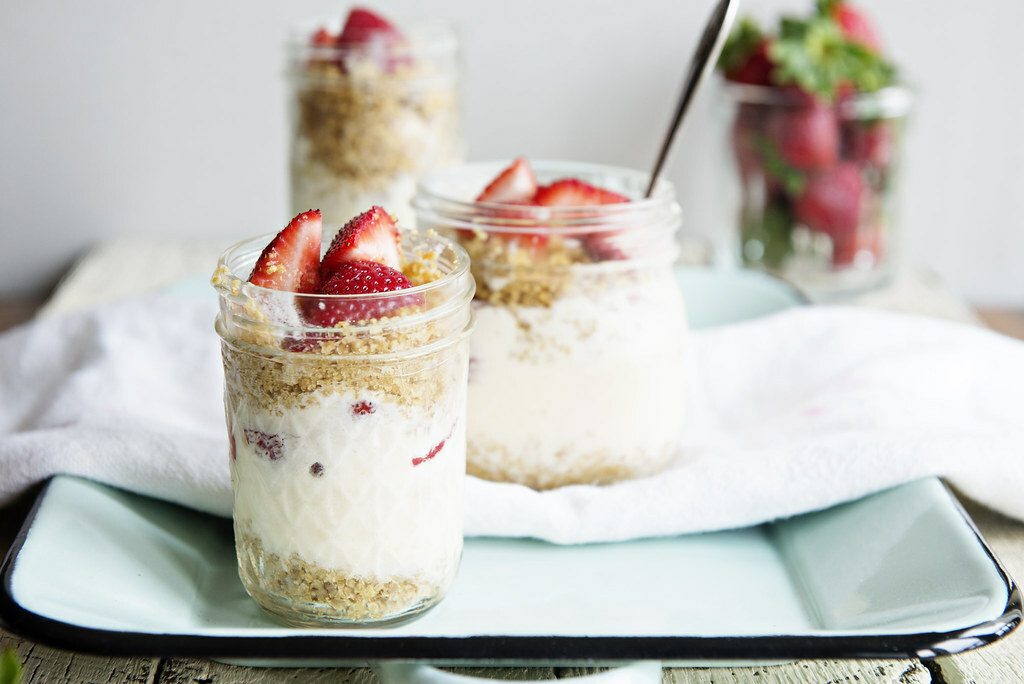 Strawberry Lemonade Ice Cream Parfaits in bowl with spoon on a paper towel