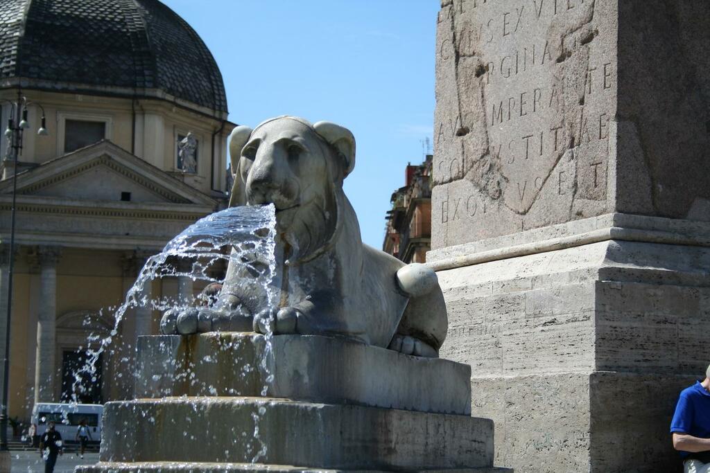 In the center of the piazza, four lion fountains flank one of the tallest Egyptian obelisks in Rome.