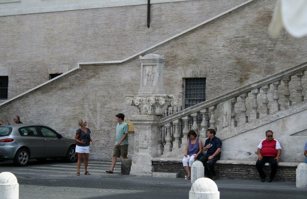 The foot of the Spanish Steps as viewed from the Fountain of the Ugly Boat.