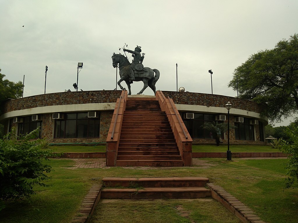 Prithviraj Chauhan III statue at a distance at Qila Rai Pithora, Delhi