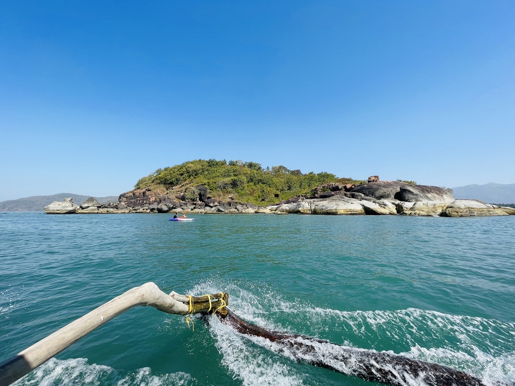 A verdant island amidst the clear blue sea