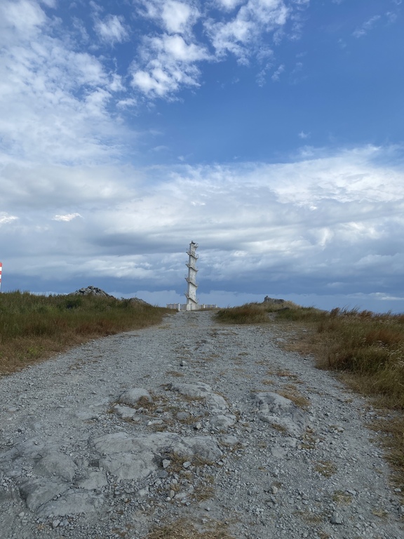 A photo of a lighthouse while walking point of view