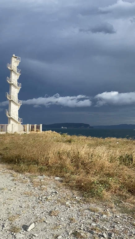 A closer photo of the lighthouse and Sisiman Bay