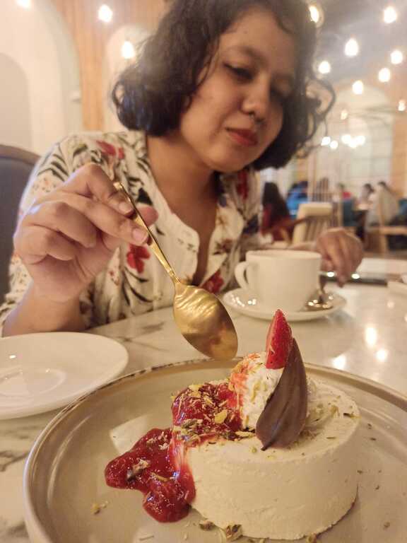 Me digging in a dessert at Fika