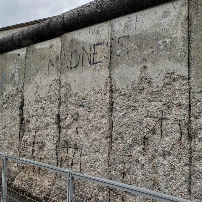 Madness written on the Berlin Wall