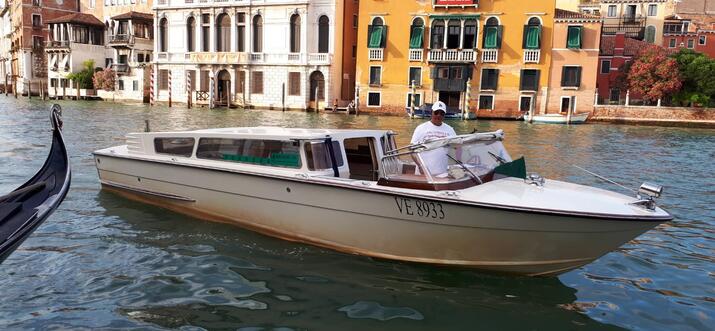 Travelling In Style In A Water Taxi In Venice