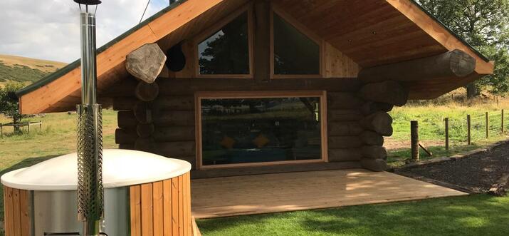 log cabin with hot tub edinburgh
