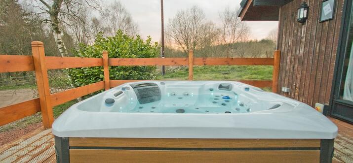 otterburn log cabins with hot tubs