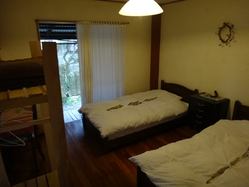 unique hotels in kunigami | a clean and chic twin bed room