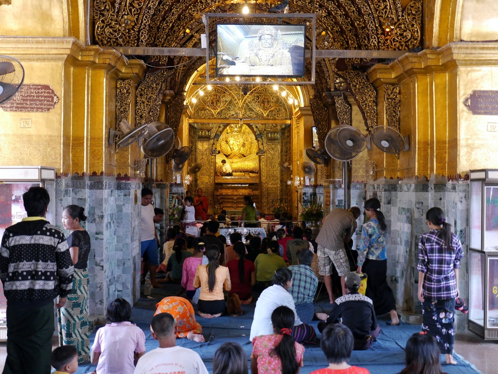 stick something on the buddha at mahamuni buddha temple