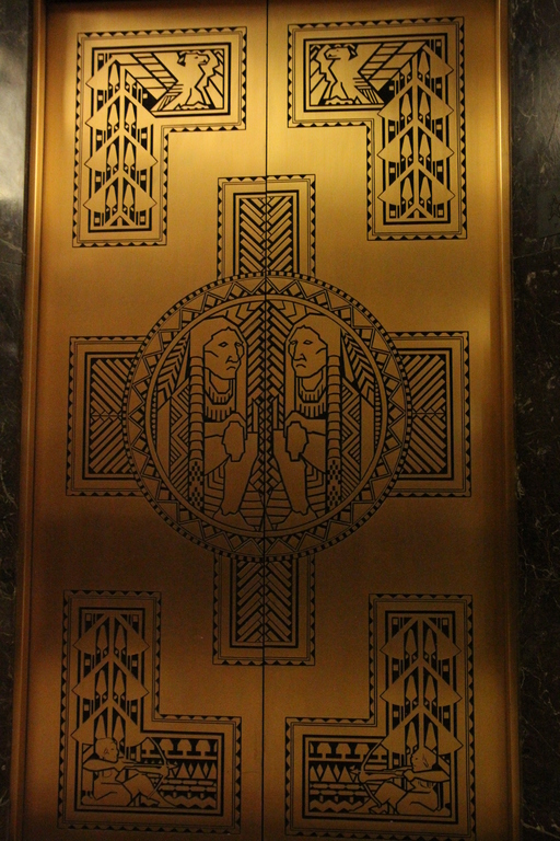 Elevator doors display the integration of Native American symbols with Deco design.