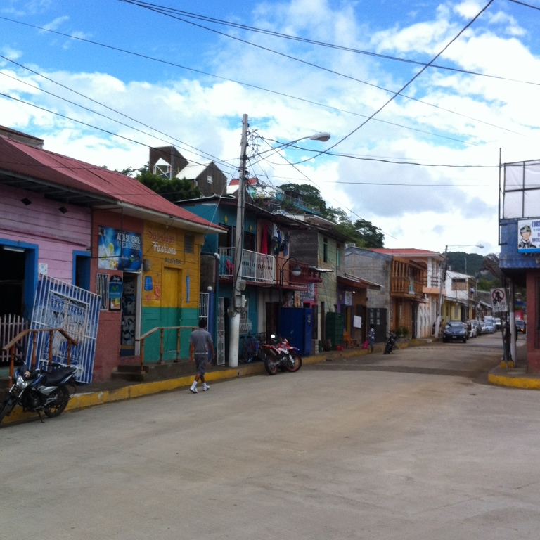 vacation apartments in san juan del sur | colorful buildings line the streets in san juan del sur