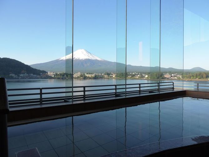 onsens in fujikawaguchiko | a full view of mt. fuji from the outdoor onsen and indoor bath with fogless windows