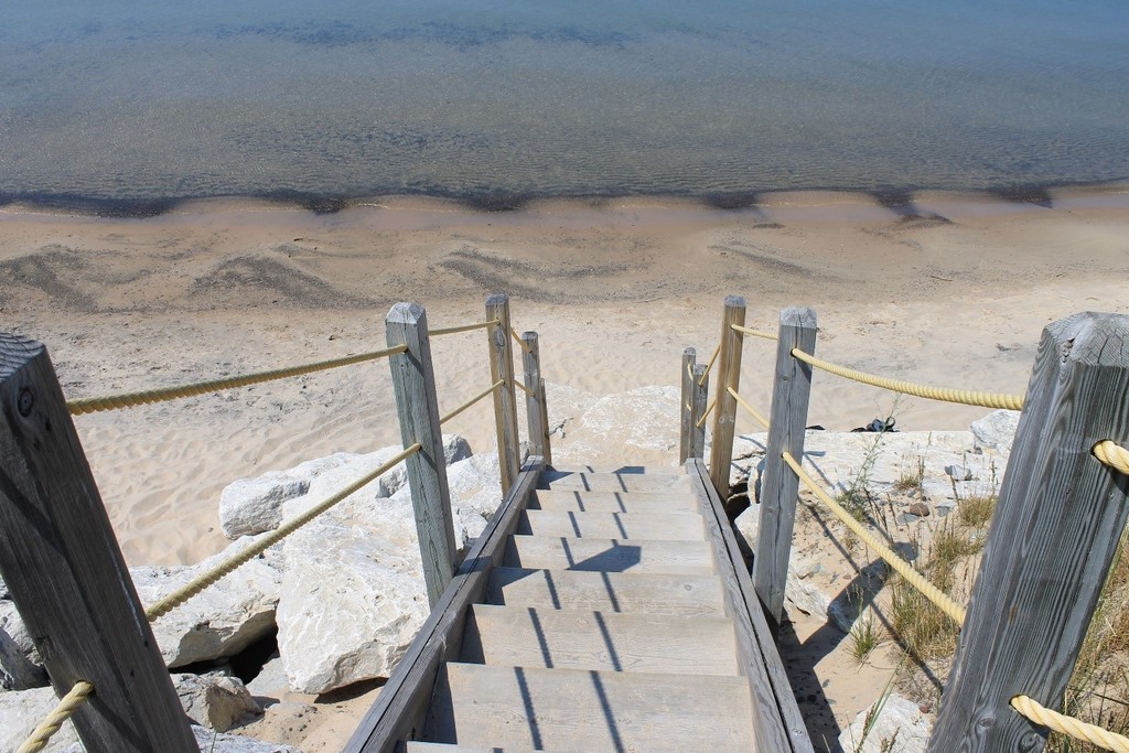 One of two boardwalk stairways leading down to the white sand beach. 
