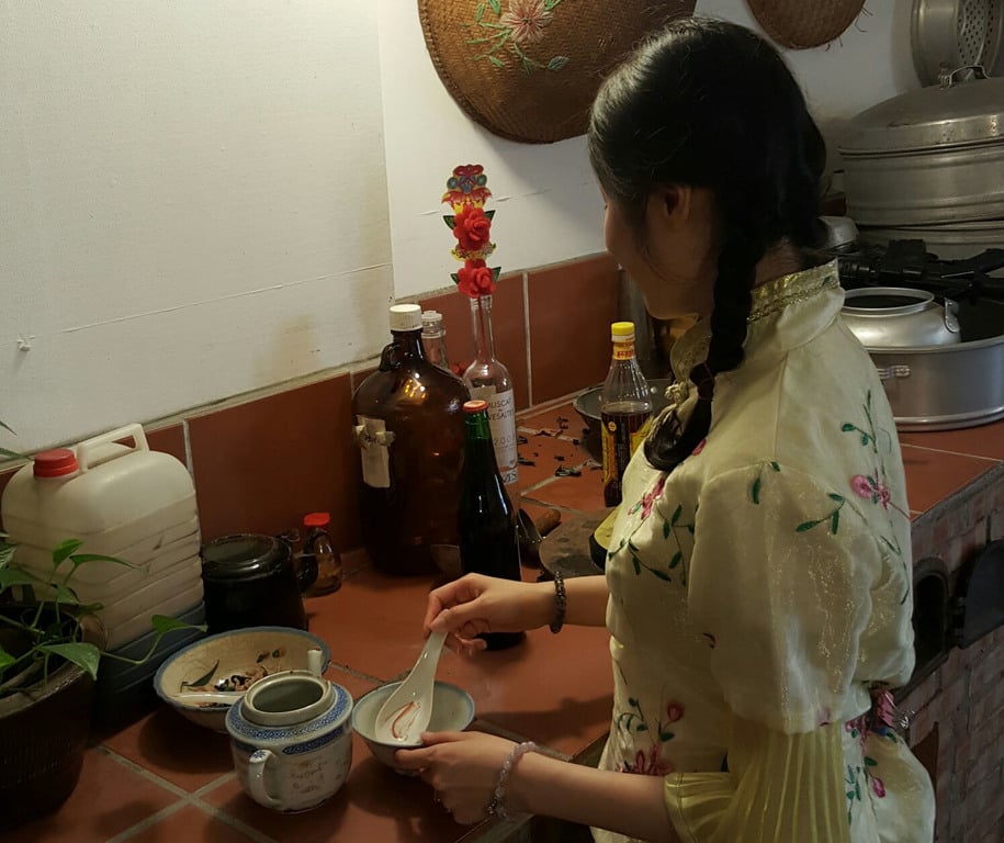 Pretending to cook in front one of the backdrop.