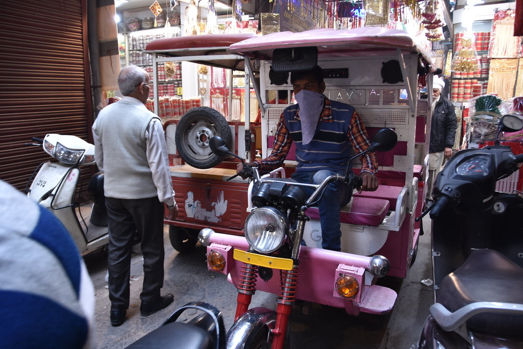 E-rickshaws literally scraping past each other
