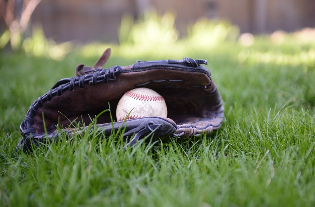 A baseball in a glove 