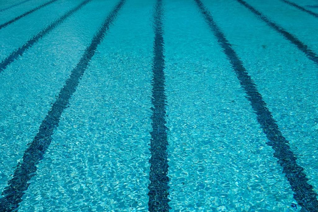 Take some laps at the Aura Water Park swimming pool