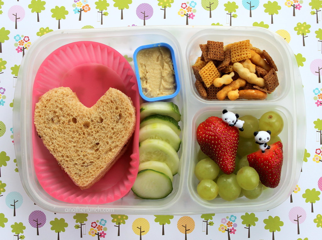 Heart shaped sandwich lunch box with cumcumbers and hummus