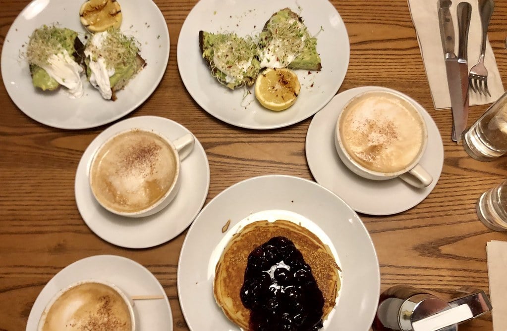 Blueberry pancakes and avocado toasts