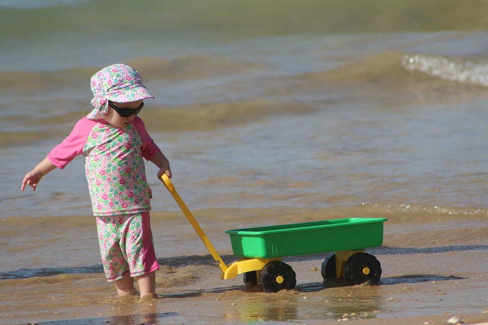 Kid playing on the beach