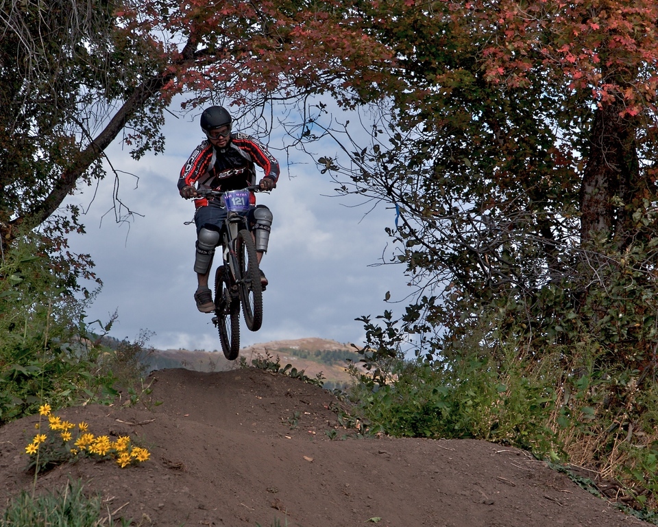 Mountain bike jumping on trail