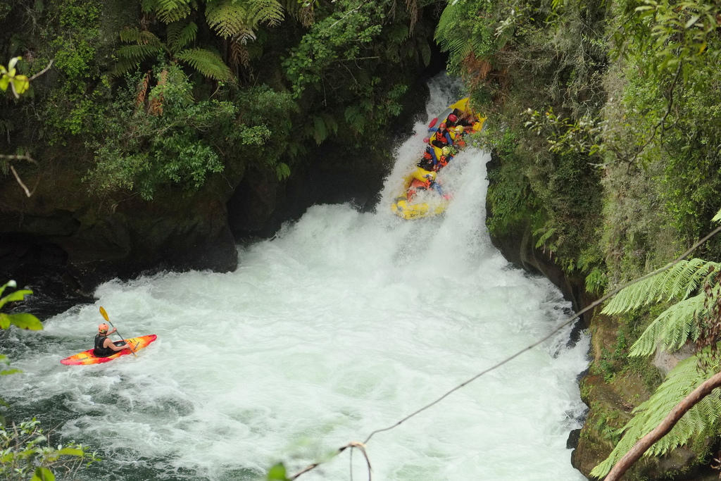 Large inflatable boat going down Tutea Falls (Kaituna River)