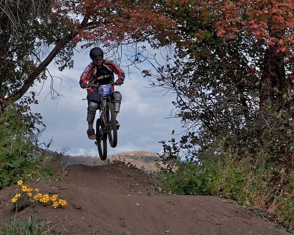 Mountain bike jumping on trail