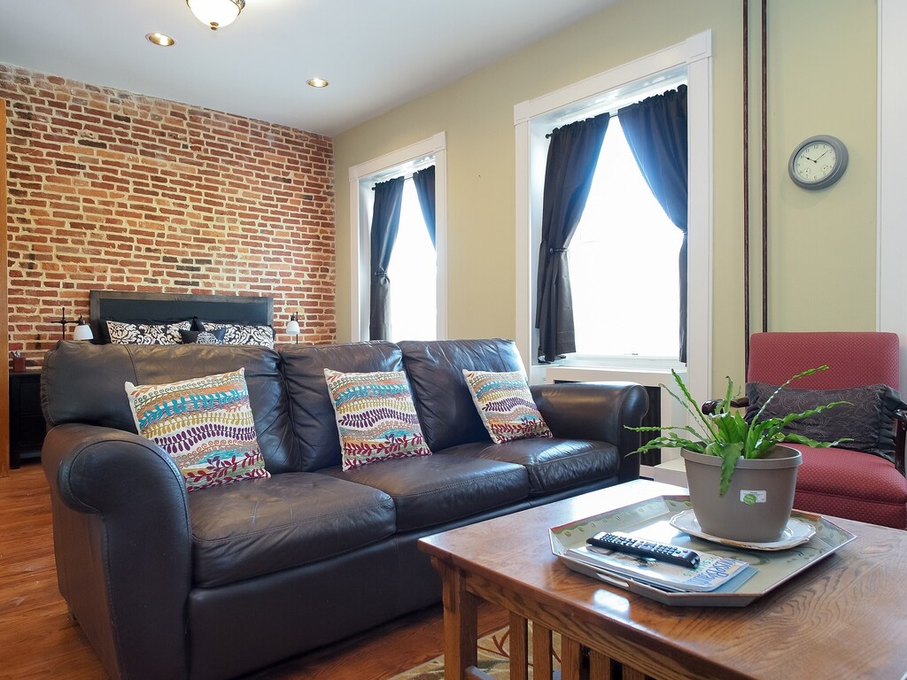 This lovely studio combines modern decor and historic charm beautifully