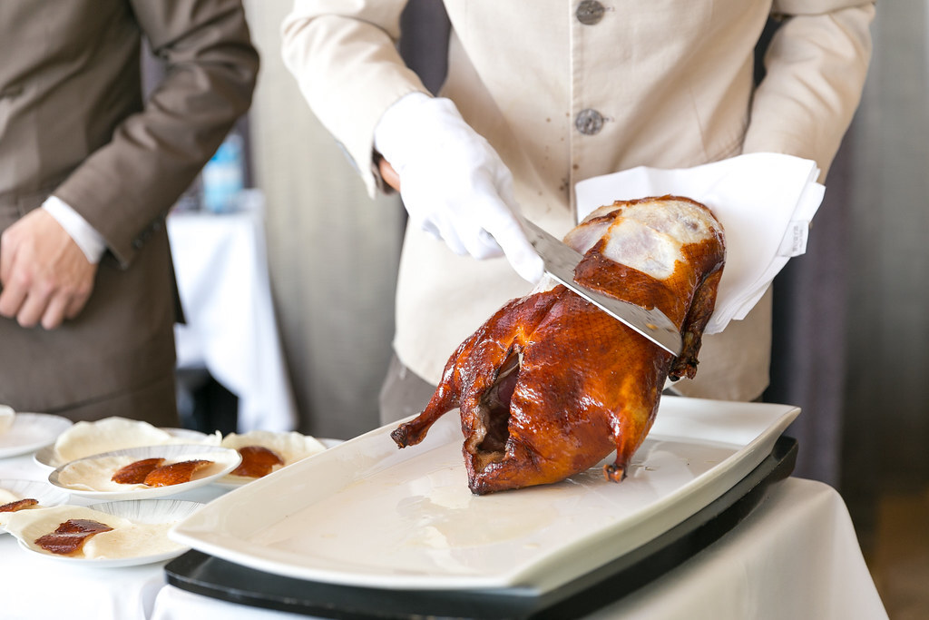 Cutting the Peking Duck skin tableside