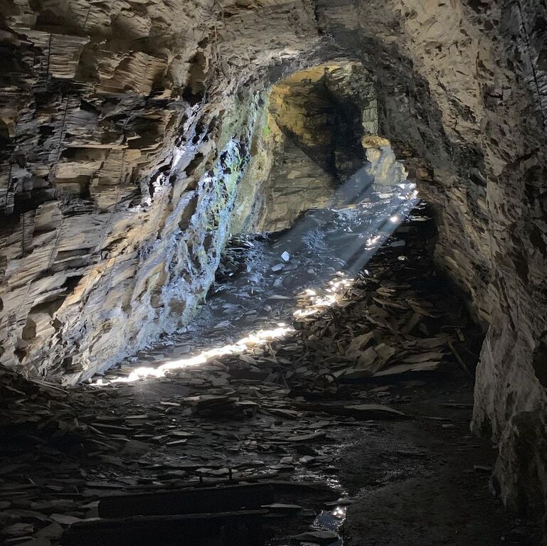 things to do in betws y coed | discover blue lakes and lofty caverns through go below underground adventures