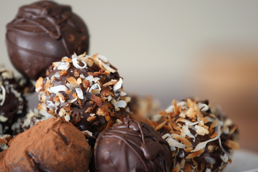 Truffles with nuts and chocolate dusting in detail