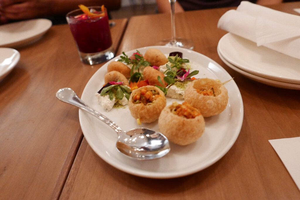 Dal and Tamarind filled Puri Pops, Young Mango Pickle, Sprouted Mung Beans, Curry Leaf Paneer by Marisa Paolillo of Mango Pickle (Chicago)