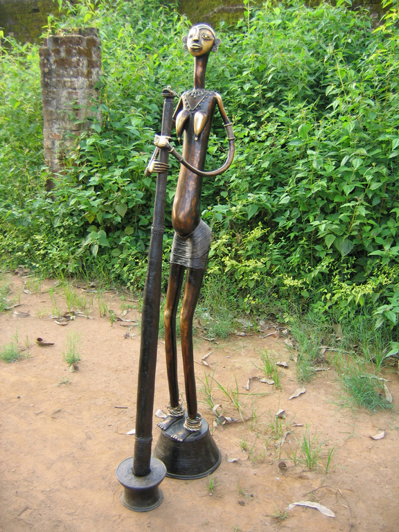 Village lady grinding ants for her family