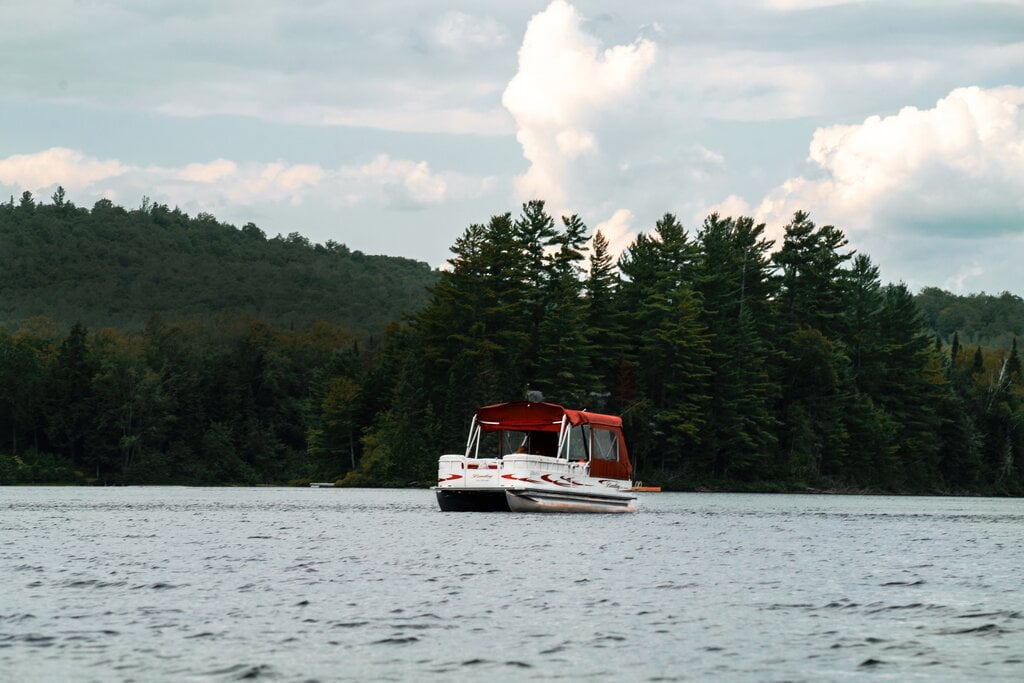 A canopied boat on a lake.