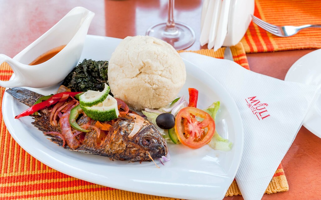 Ugali and Samaki with some side of Sukumawiki